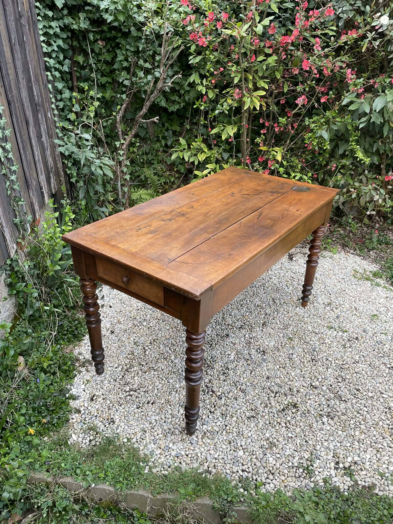 Old kitchen table with chopping board.