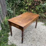 Old kitchen table with chopping board.