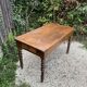 Old kitchen table with chopping board