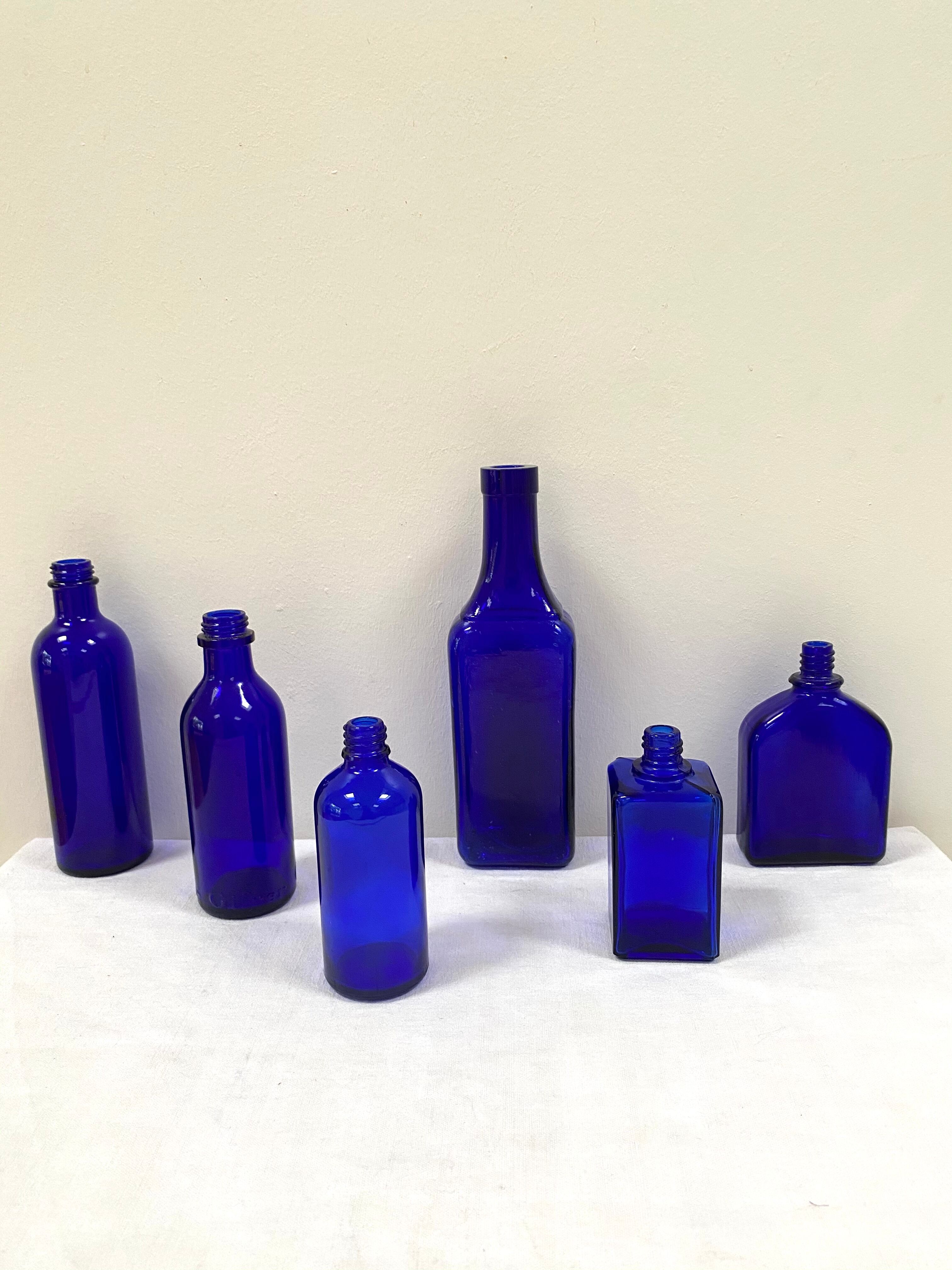 Set of 6 cobalt blue glass pharmacy bottles