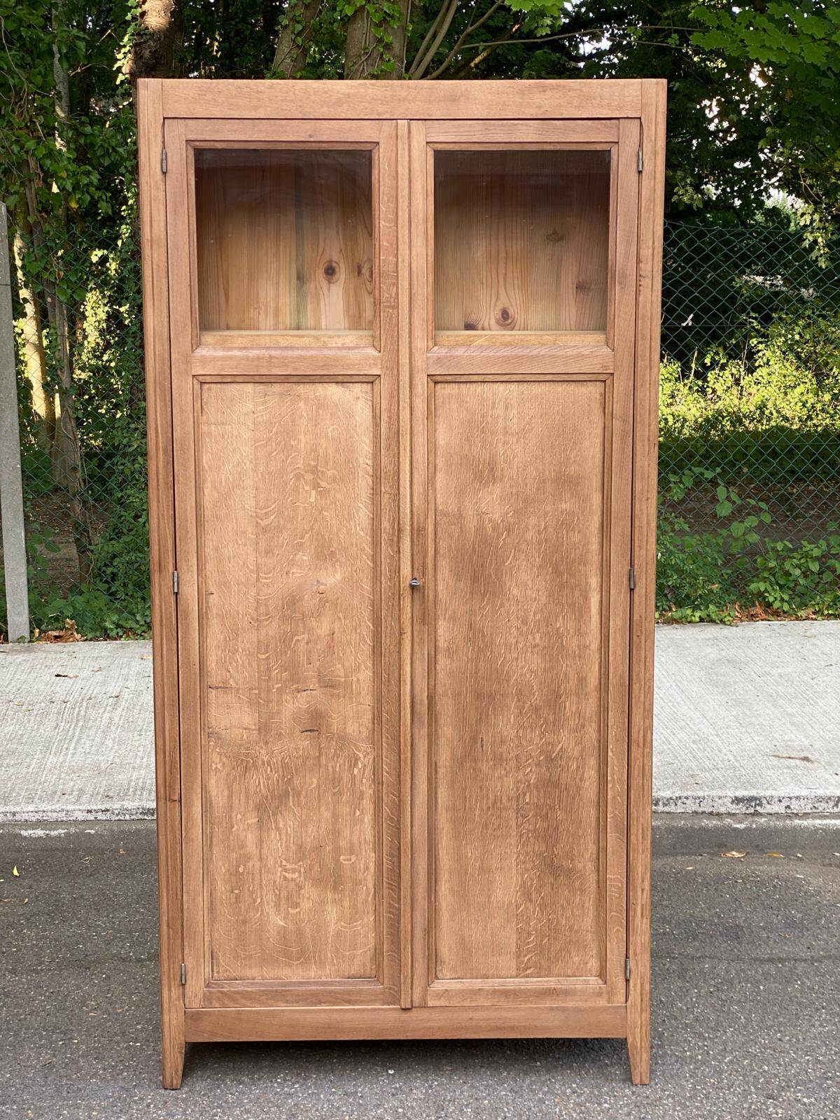 Parisian bonnetière cabinet, stripped display in solid oak from the 1930s.