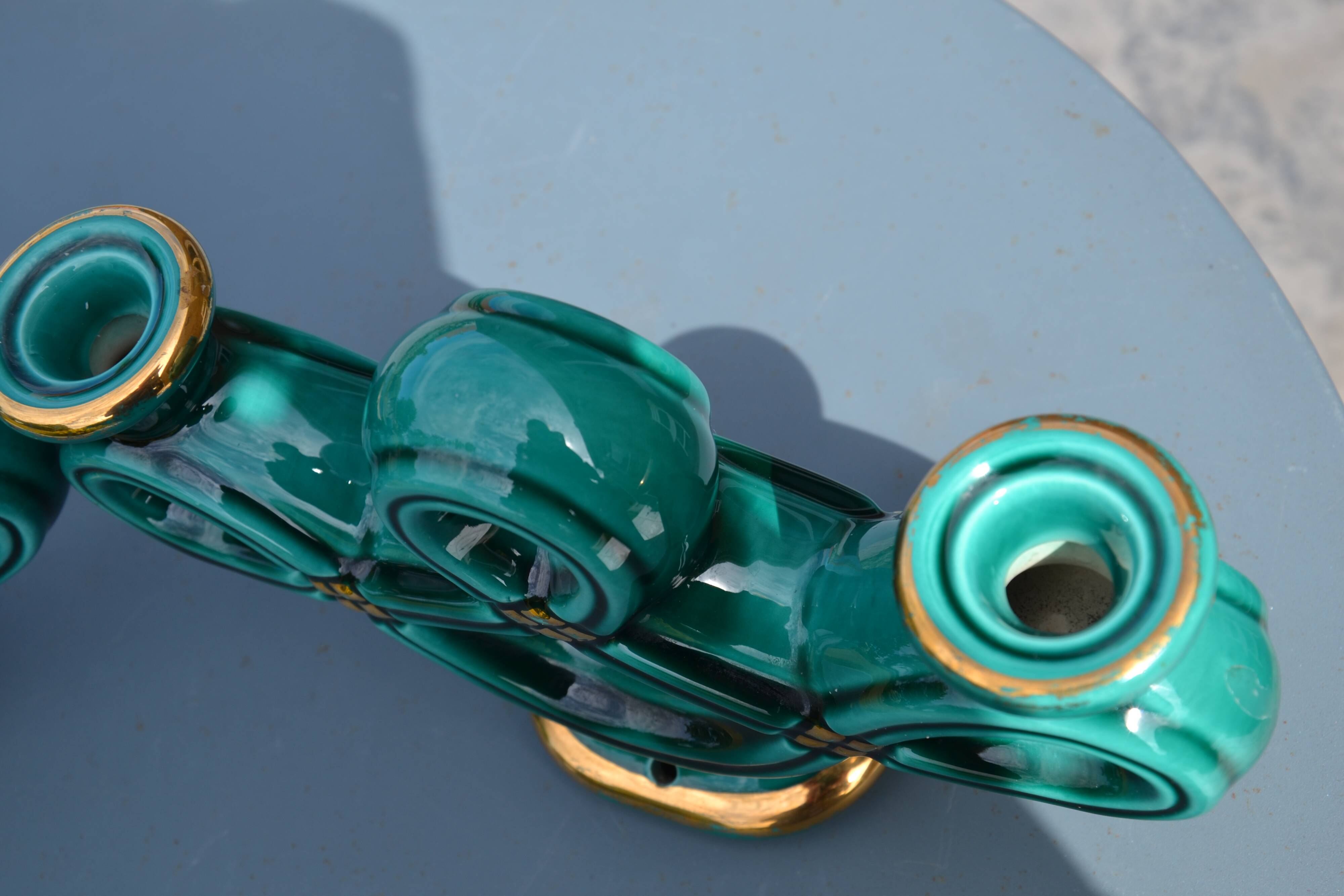 Two green ceramic candlesticks from the 1930s-1940s.