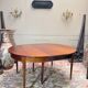 Dining table with a mahogany band in louis xvi style