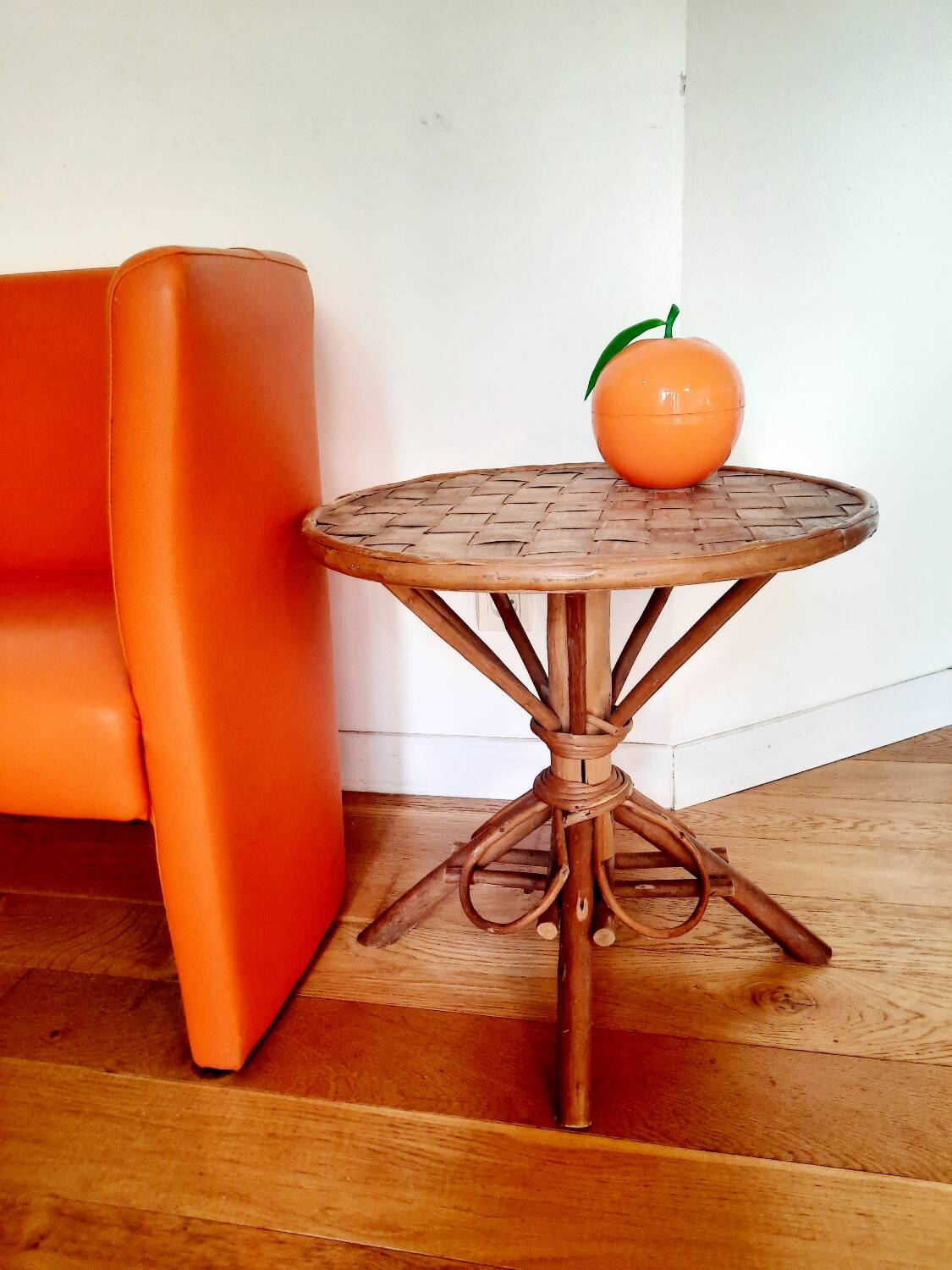 Old bamboo/rattan table with woven palm leaves.