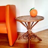 Old bamboo/rattan table with woven palm leaves.
