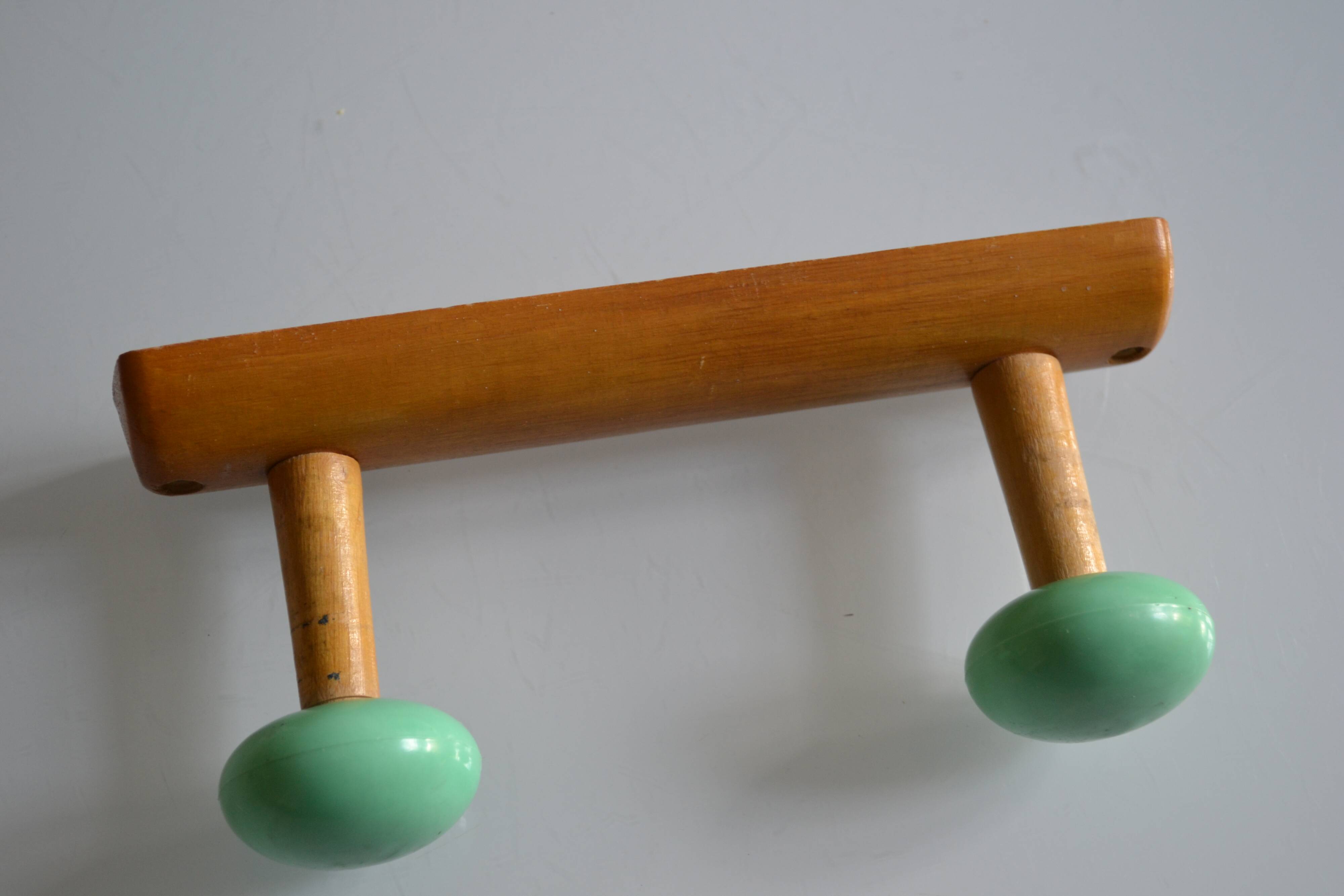 Wall coat rack with 2 hooks, wood and plastic, 60s style.
