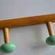 Wall coat rack with 2 hooks, wood and plastic, 60s style.