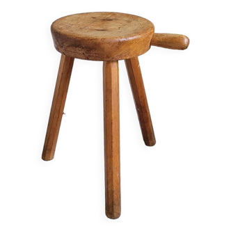 Solid wood tripod stool.
