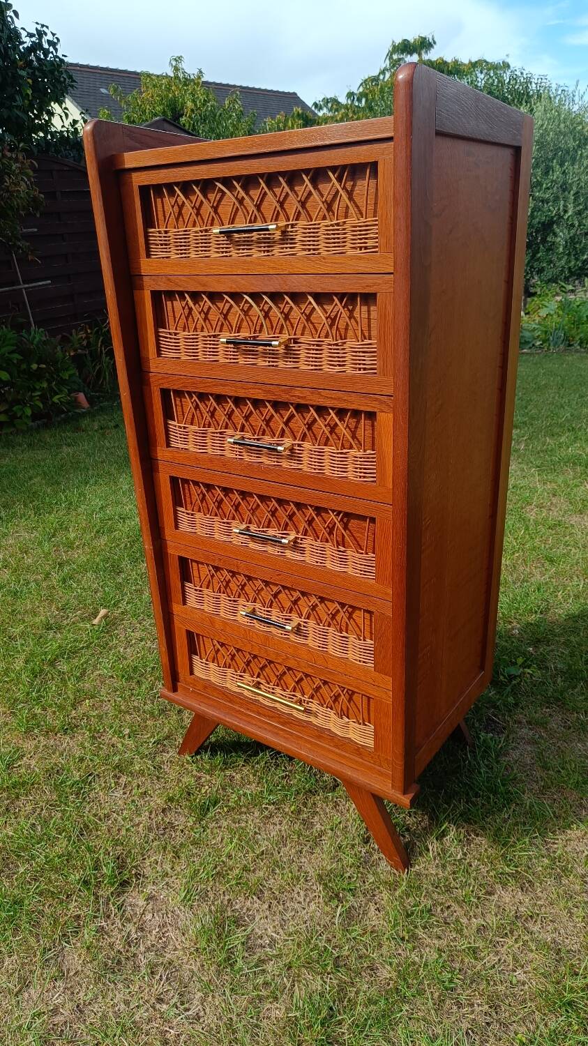 Tall chest of drawers in wood and rattan with splayed legs