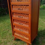 Tall chest of drawers in wood and rattan with splayed legs