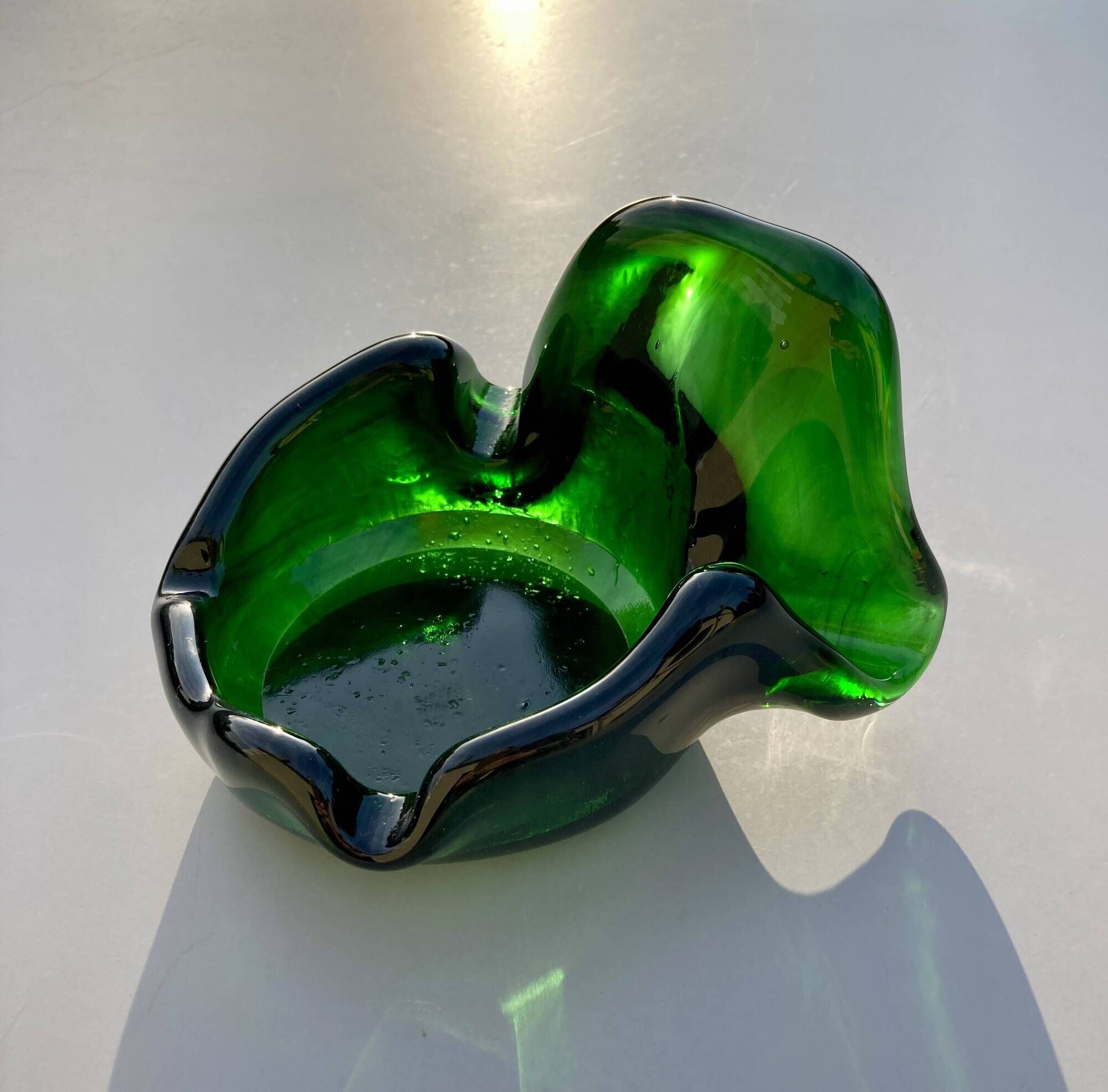 Sculptural ashtray in emerald green glass