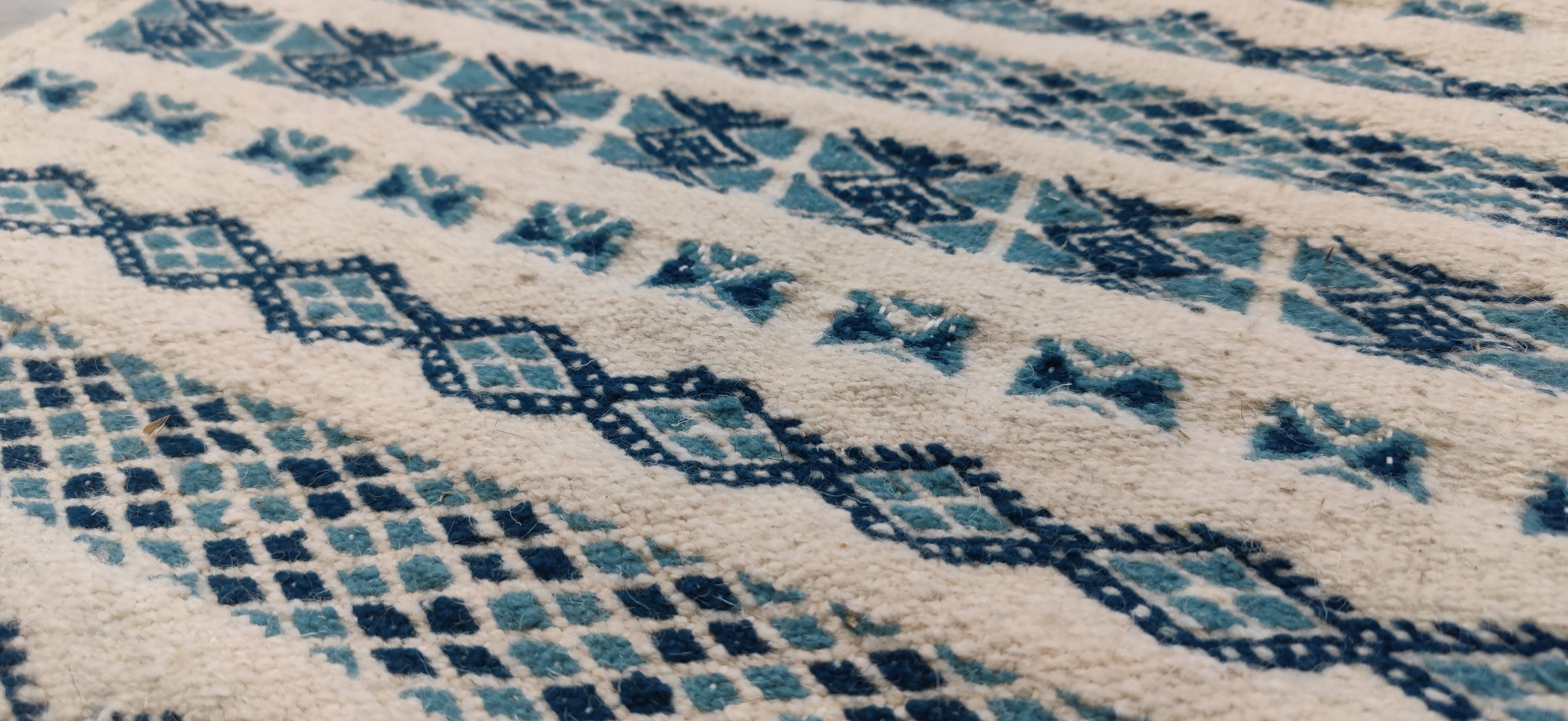 Traditional handmade white and blue carpet