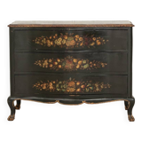 Green chest of drawers with floral decorations