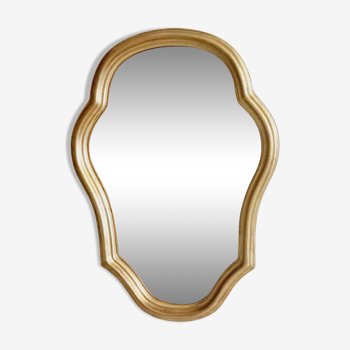 Free form mirror in golden wood