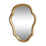 Free form mirror in golden wood