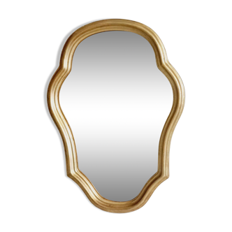 Free form mirror in golden wood