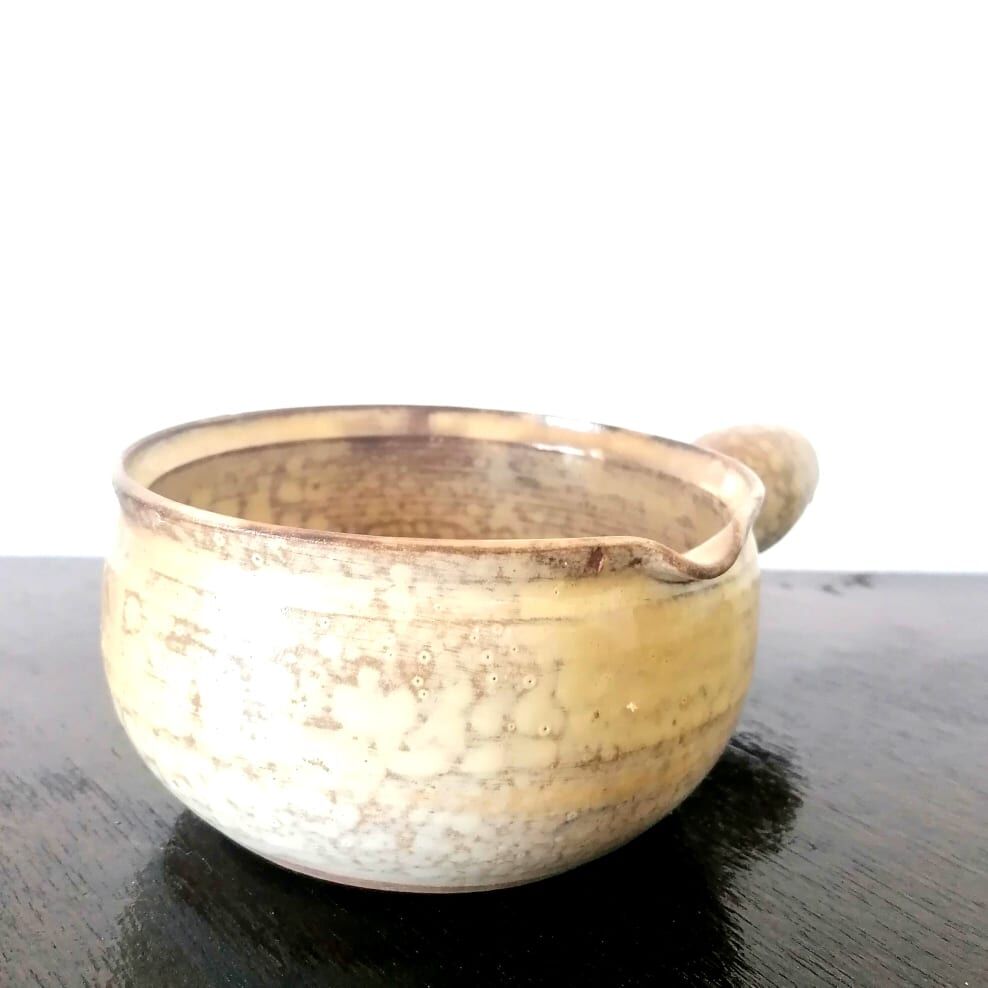 Beige glazed terracotta caquelon