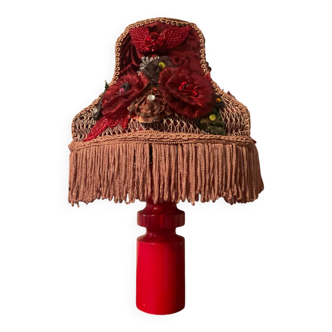 Scandinavian wooden lamp with fringed shade.