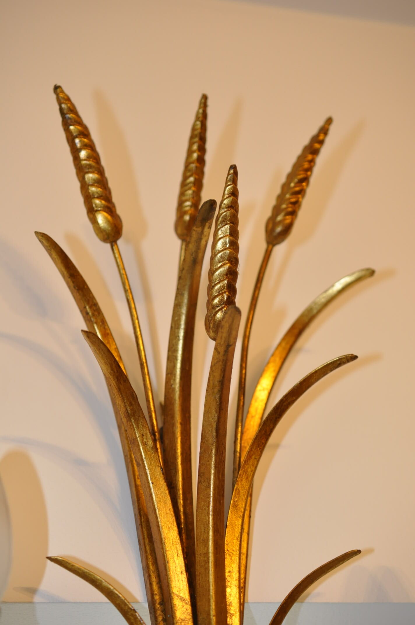 Golden metal wall sconce