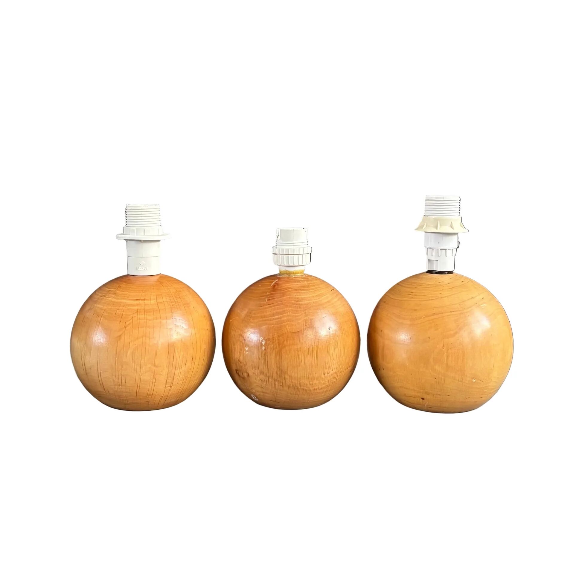 Three wooden ball-shaped lamp stands in light wood.