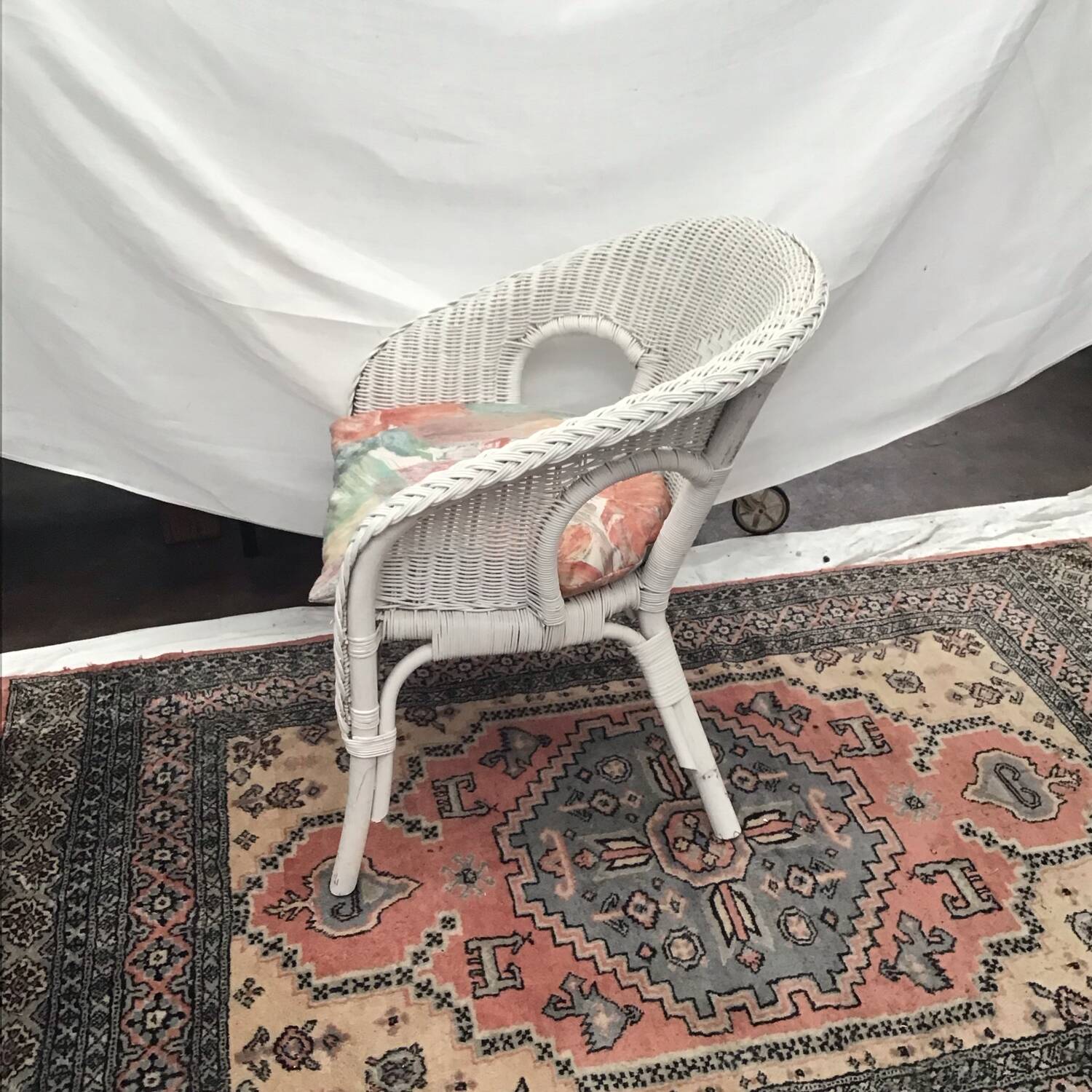 White rattan armchair with pretty vintage