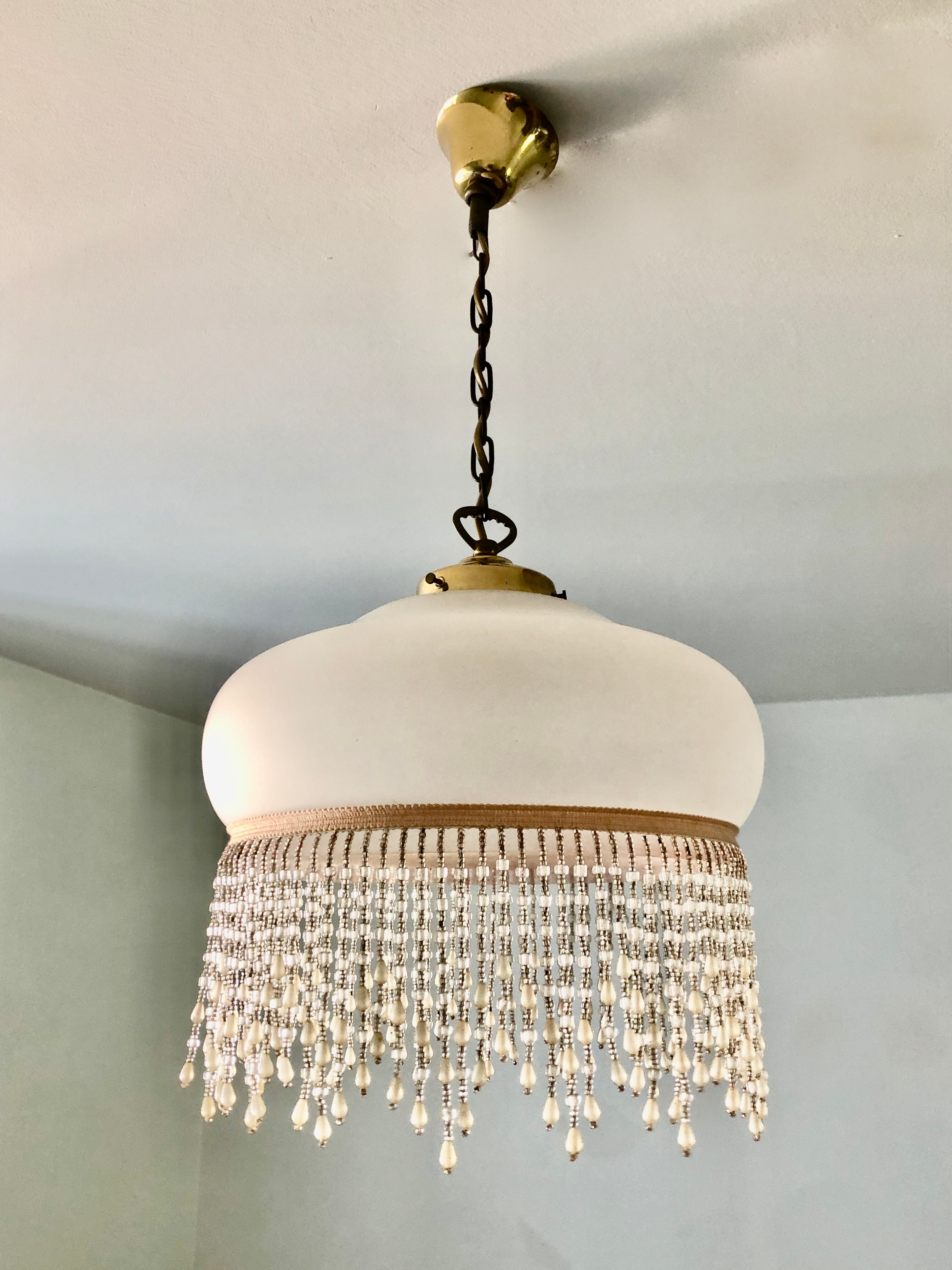 Pink half-shell suspension with pearl fringe