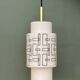 Vintage suspension globe in white opaline with black drawings.