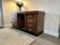 Vintage Art Deco curved sideboard with glass handles.
