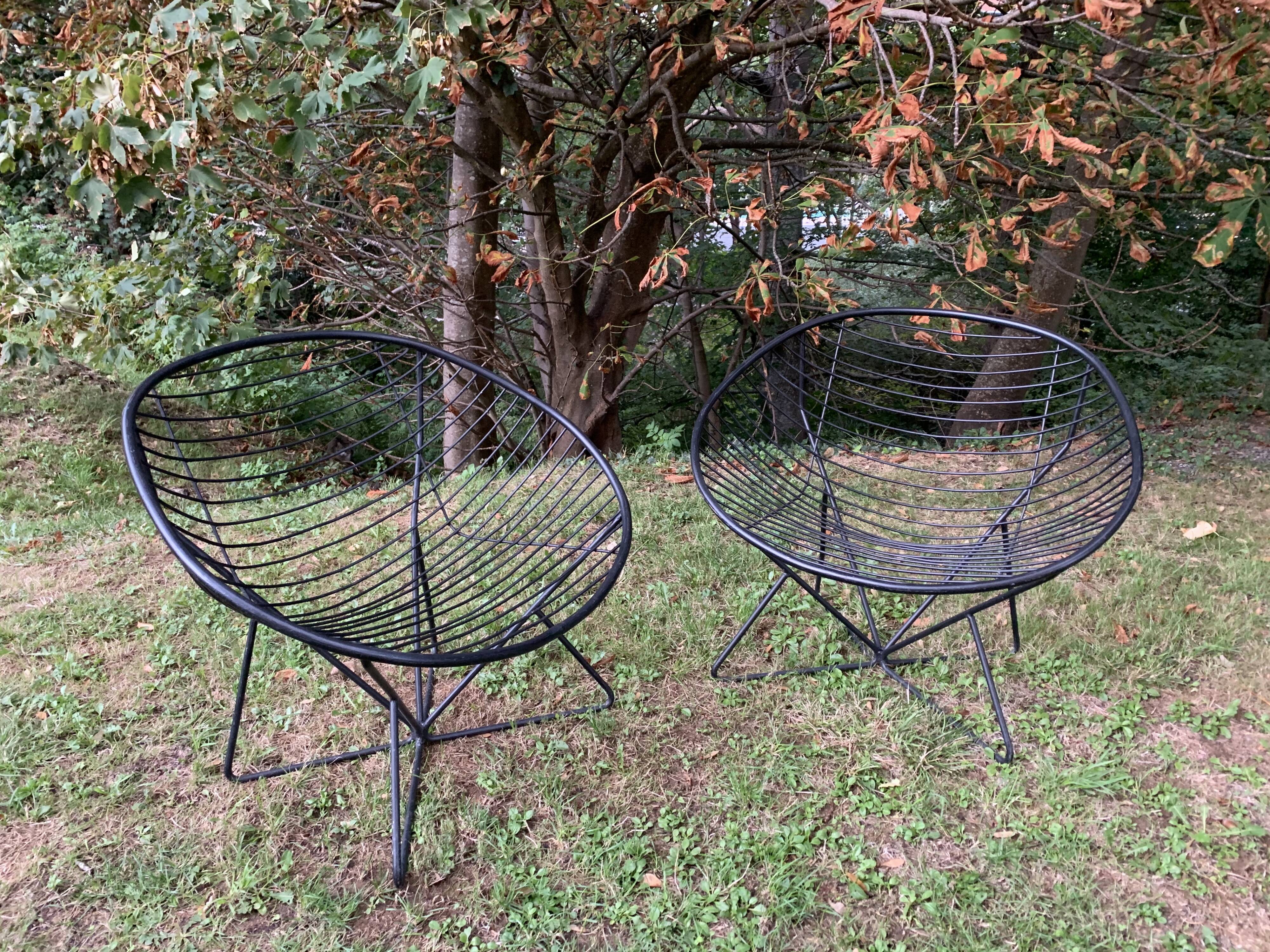 Pair of round chairs in black tubular steel 1960