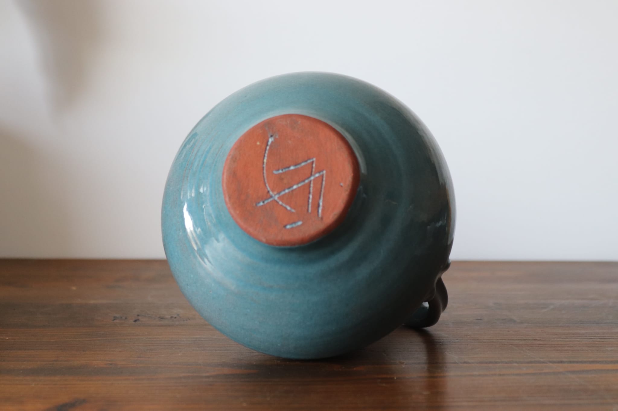 Varnished blue terracotta pitcher