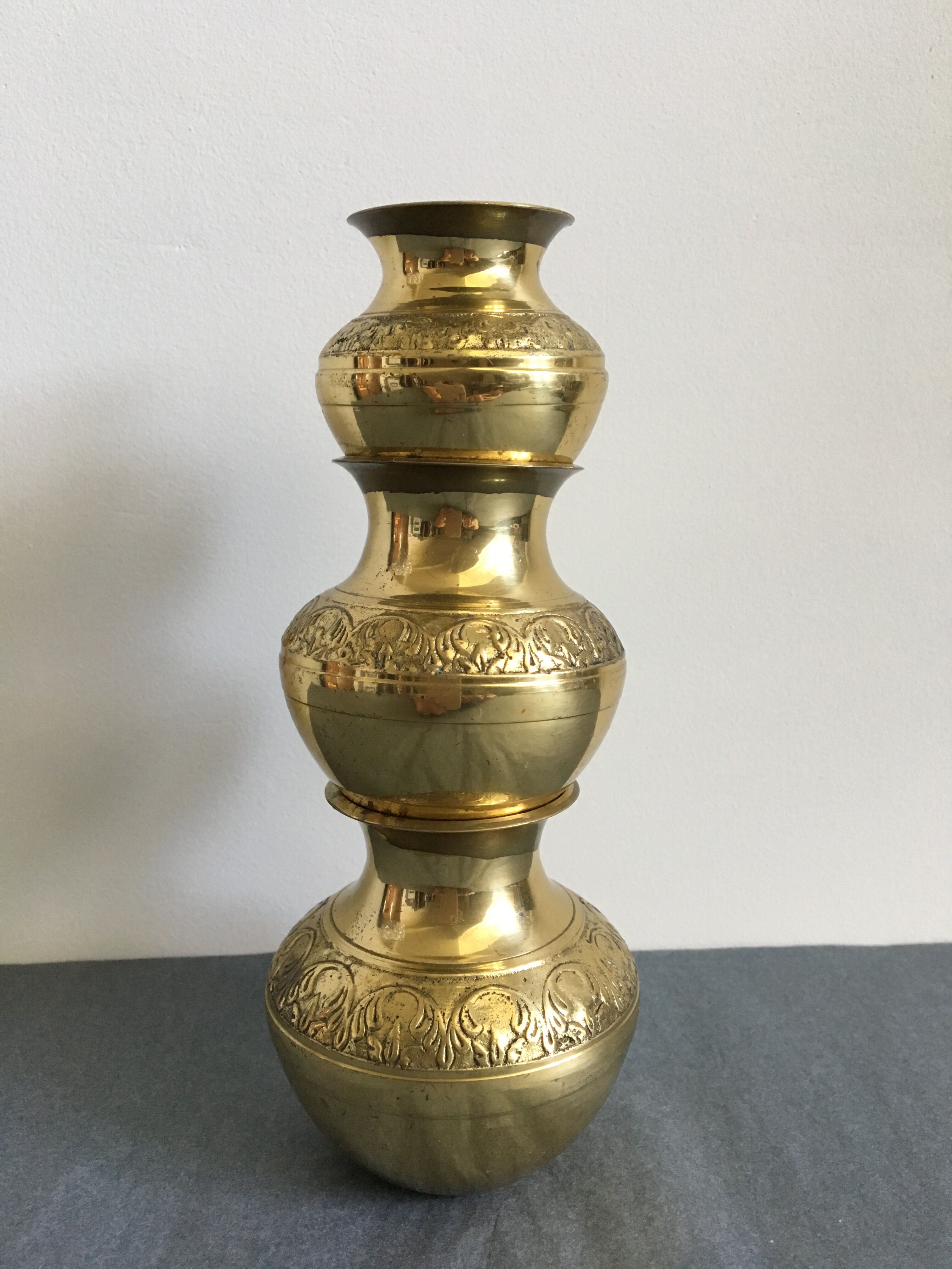 Three small brass vases