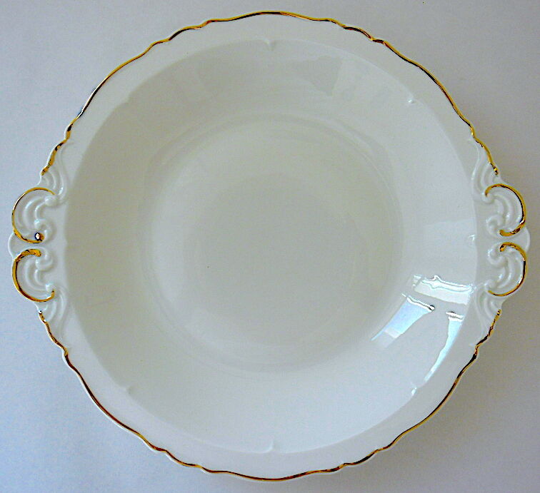 Hollow dish in white porcelain, golden lip.