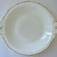Hollow dish in white porcelain, golden lip.