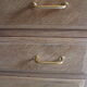 Commode aux pieds compas en bois brut