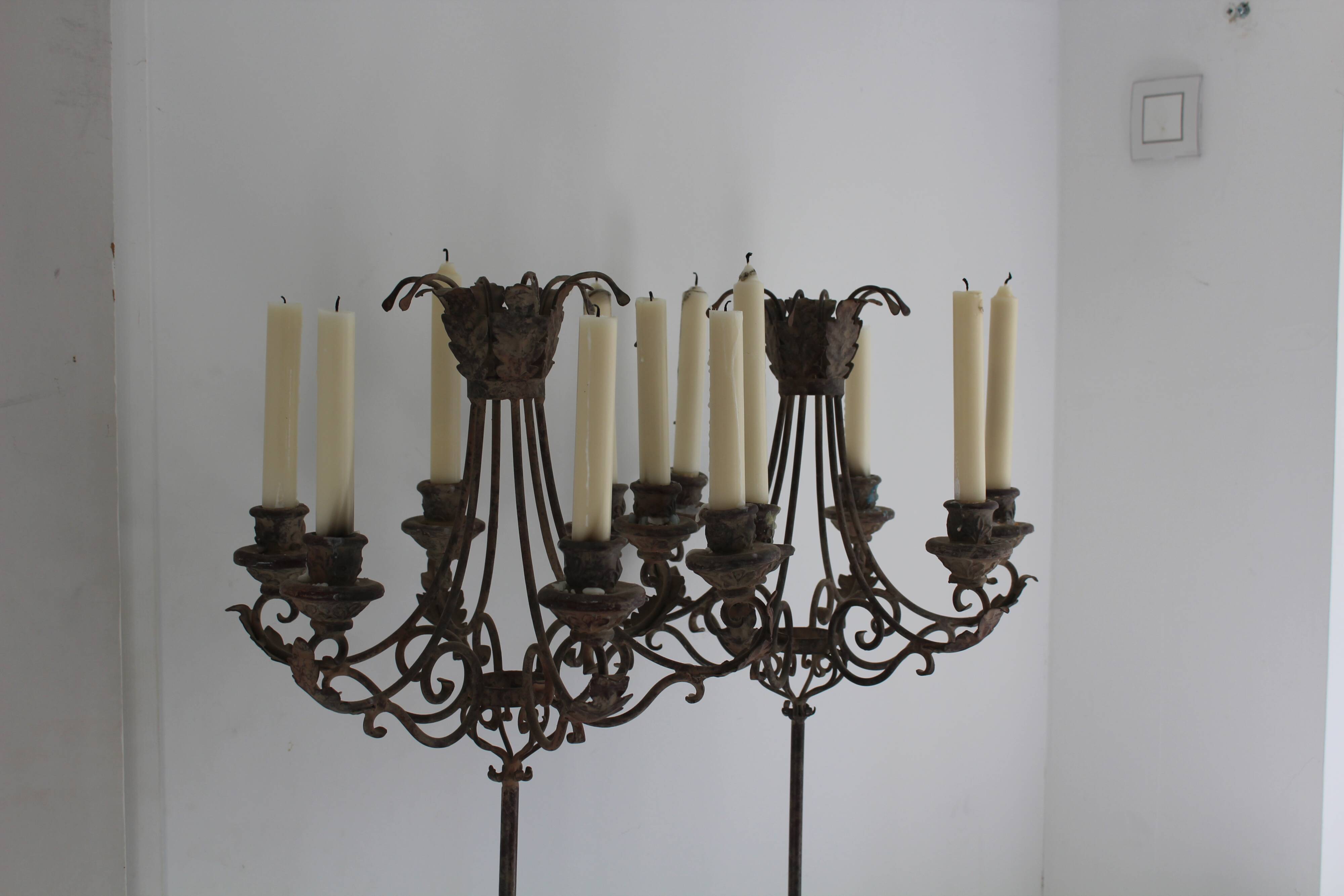 Candles on feet,  candelabras