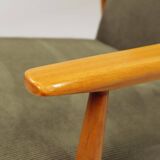 Mid-century modern design armchair in olive green corduroy.