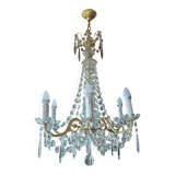 Antique chandelier with pendants in bronze and crystal.
