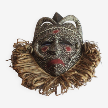 African mask with raffia and kaolin dots