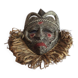 African mask with raffia and kaolin dots