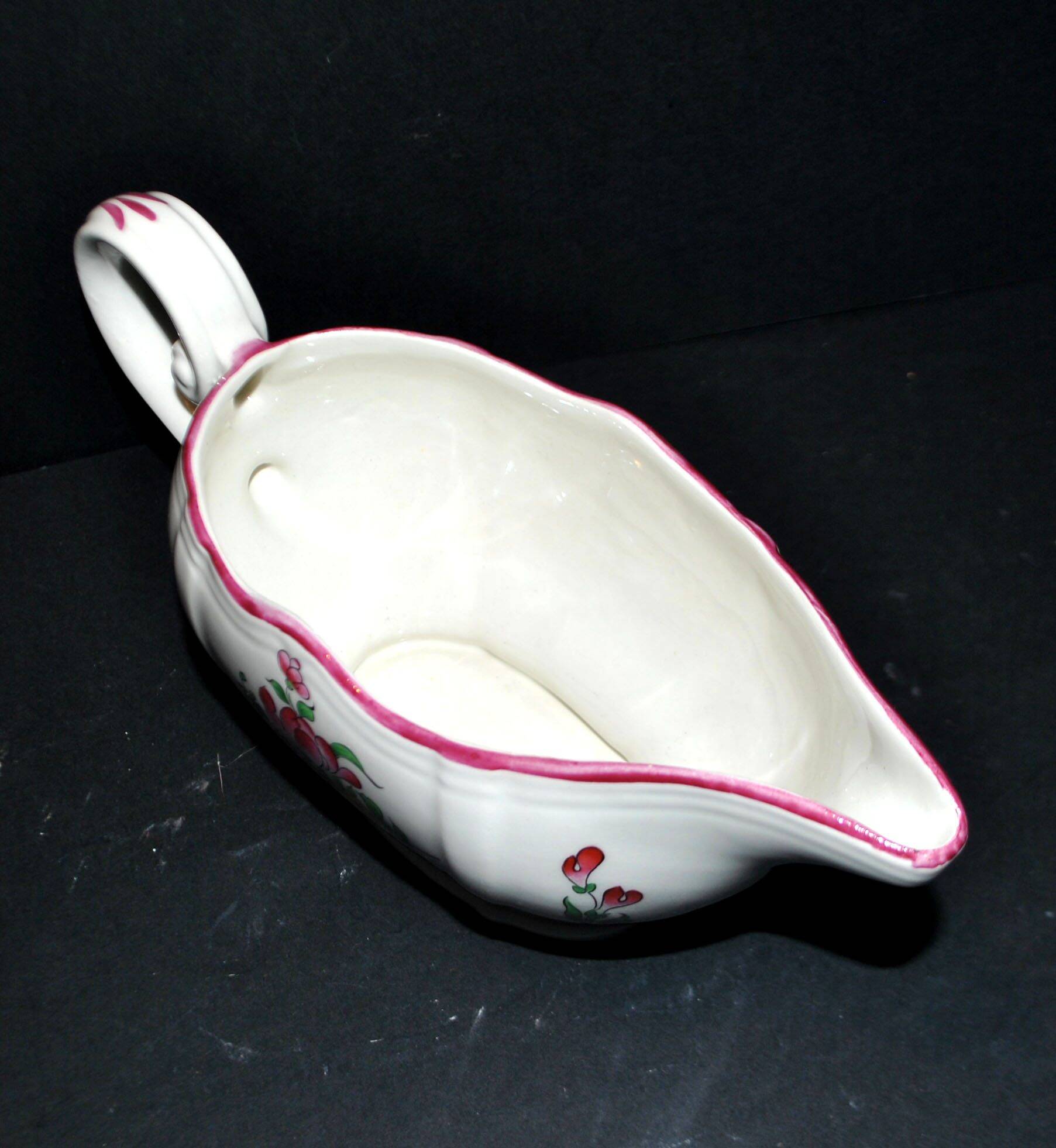 Lunéville KG earthenware sauce boat with polychrome painted flowers, revolving lamp.