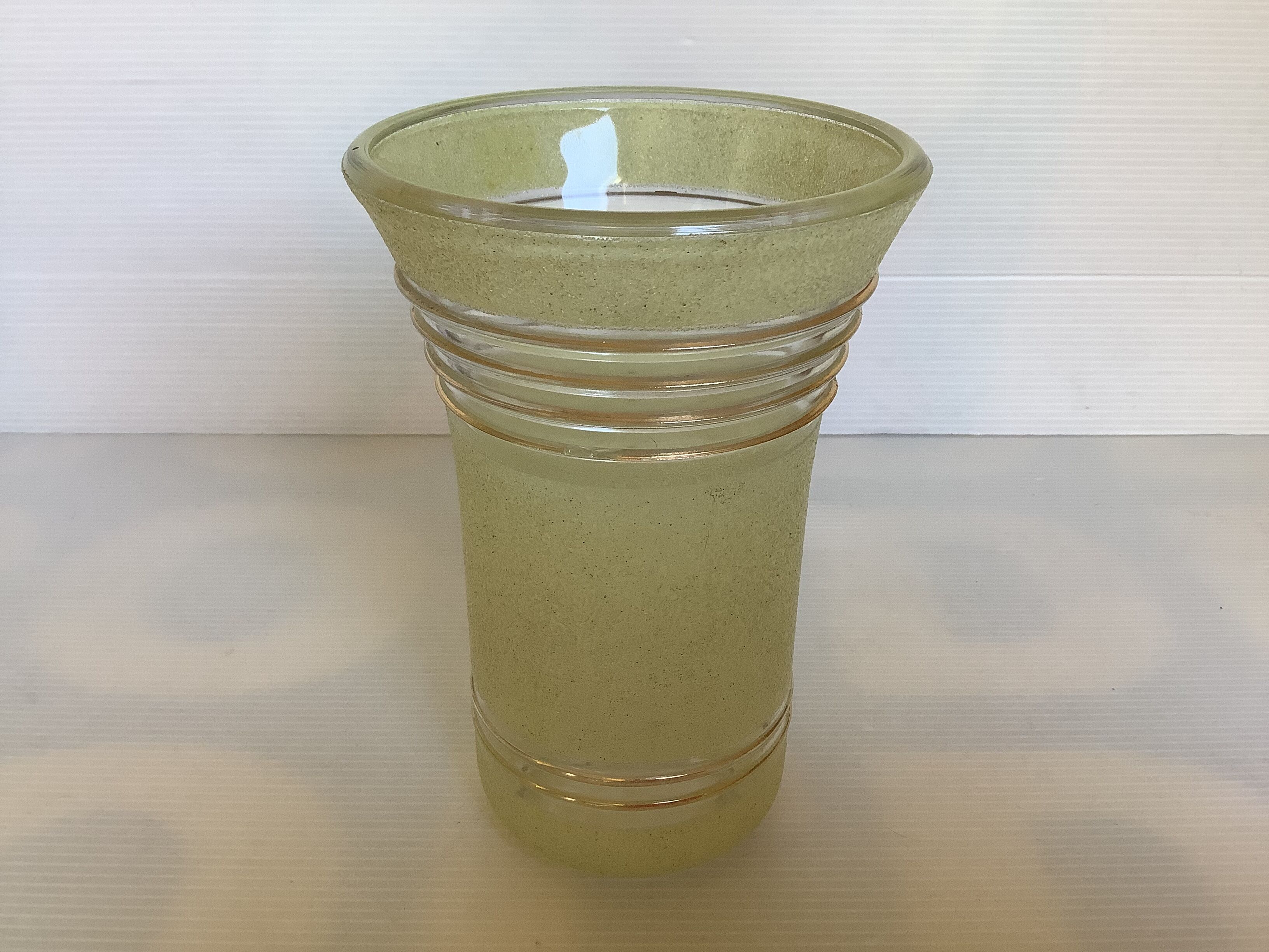 Old yellow frosted glass vase