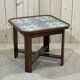 Art Deco side table in mahogany and top covered with a fabric under glass plate