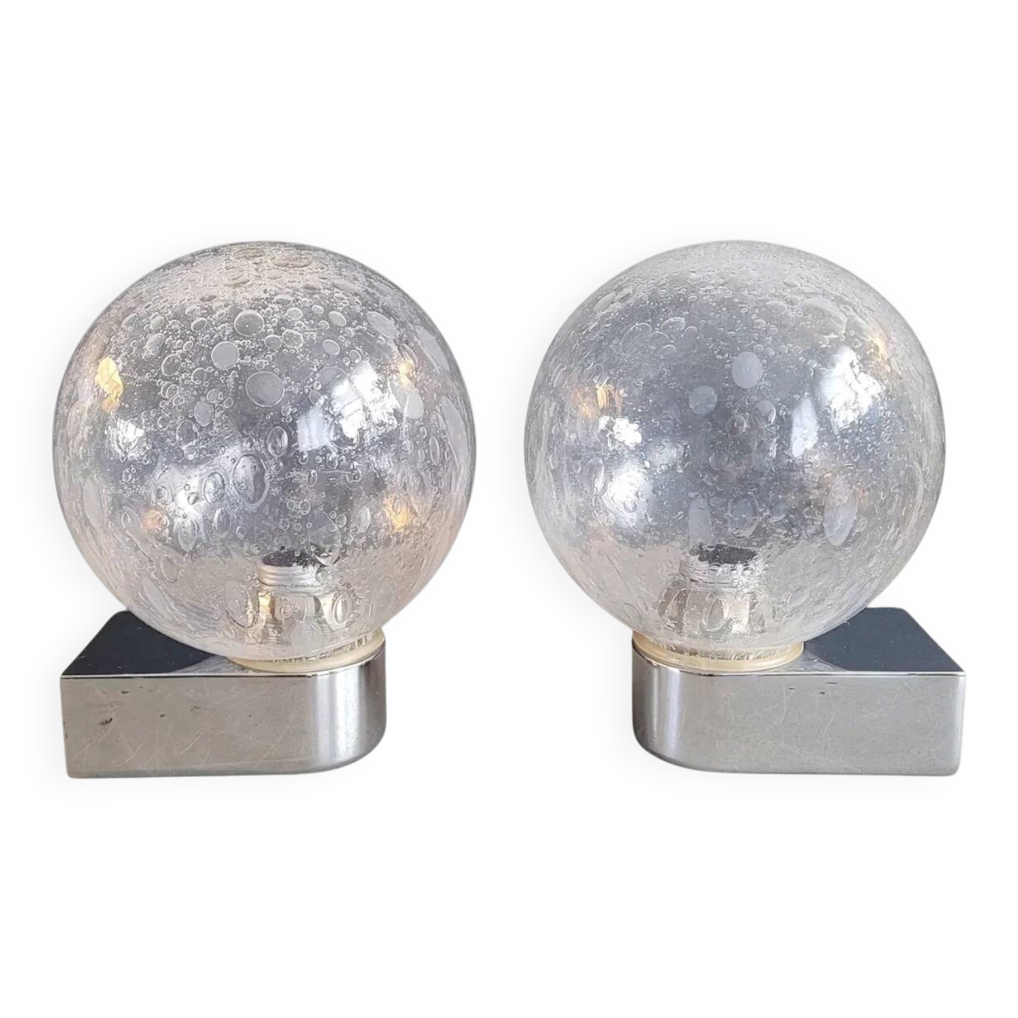 Pair of vintage wall lights in chrome metal with bubbled glass globes.