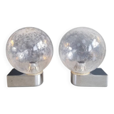 Pair of vintage wall lights in chrome metal with bubbled glass globes.