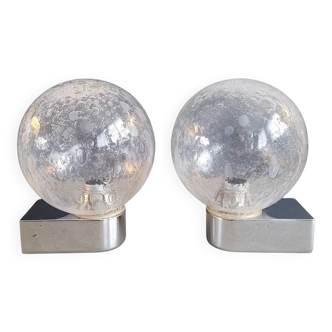 Pair of vintage wall lights in chrome metal with bubbled glass globes.