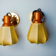 Pair of articulated "Cocoon" wall lights, resin and pine, Italy, 1970