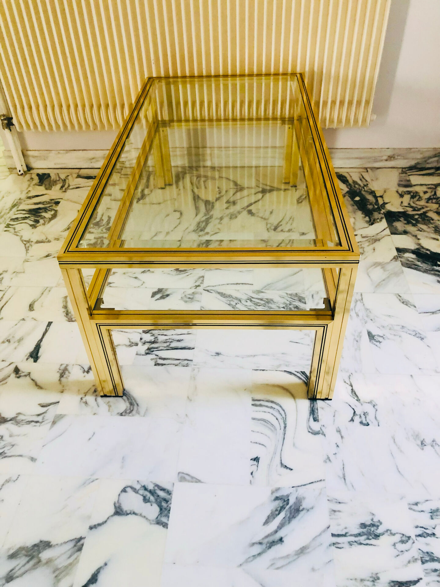 Coffee table with 2 brass and glass tops signed Pierre Vandel Paris, circa 70s.