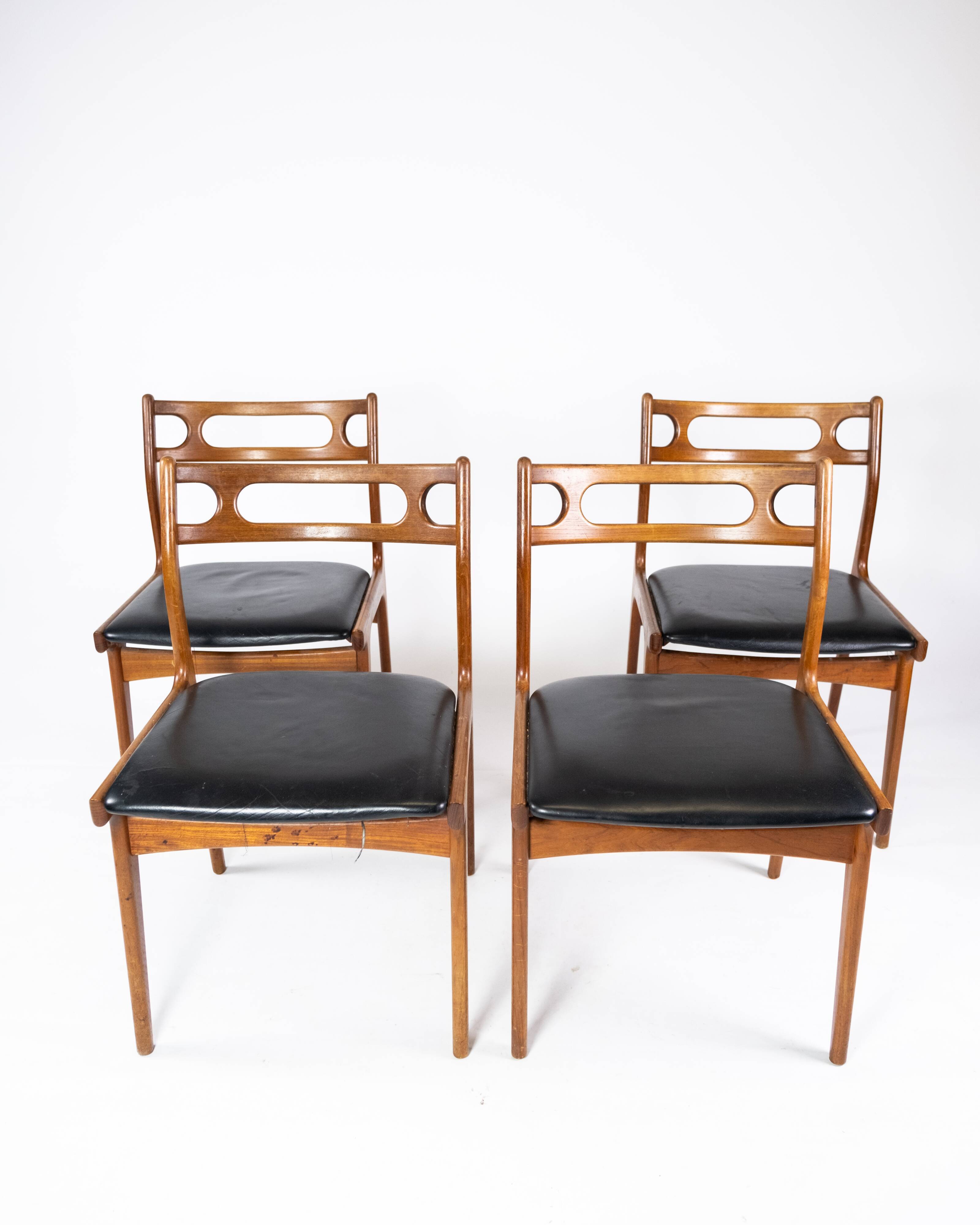 A set of four dining room chairs of teak of danish design, 1960s