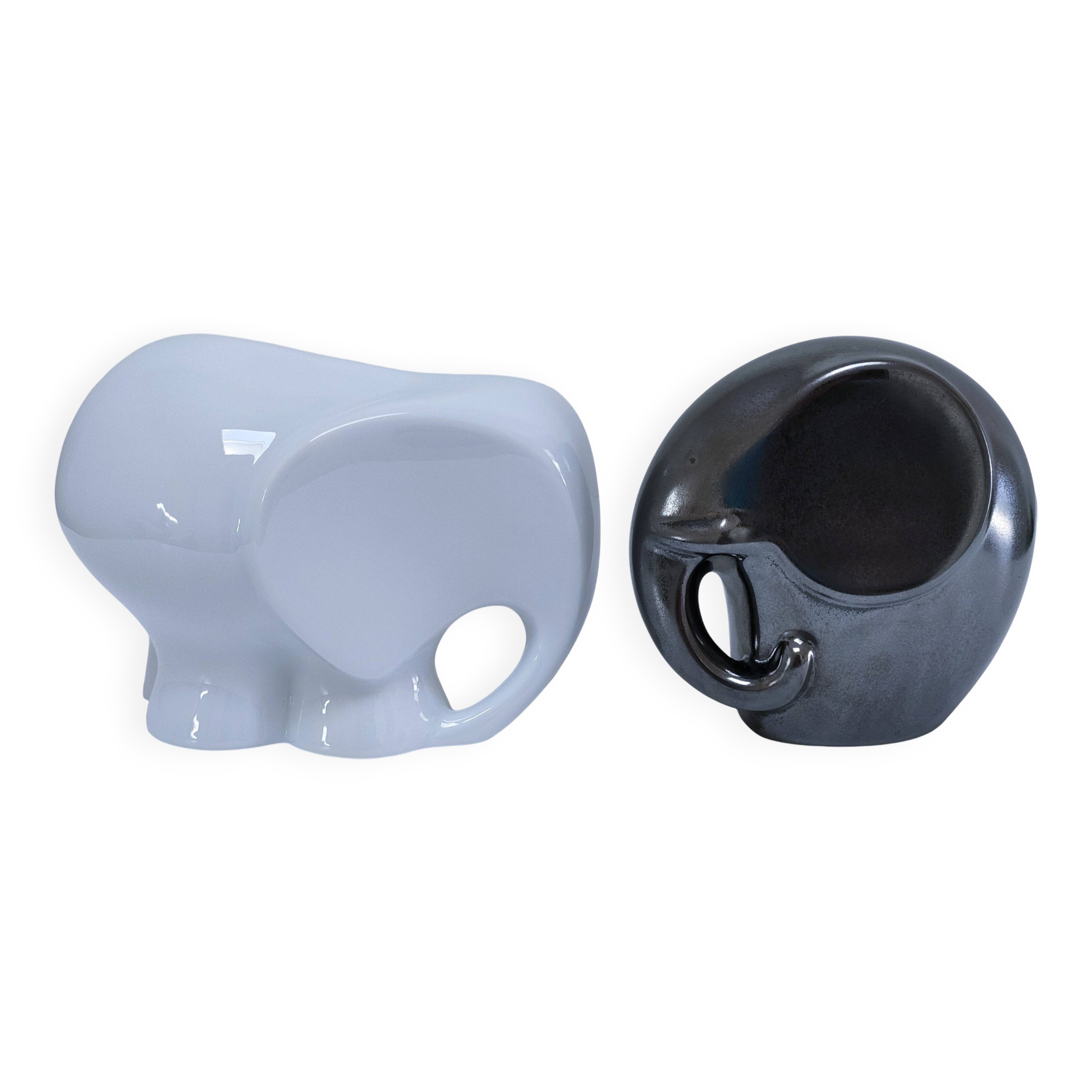 Two iridescent black and white ceramic elephants design