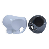 Two iridescent black and white ceramic elephants design